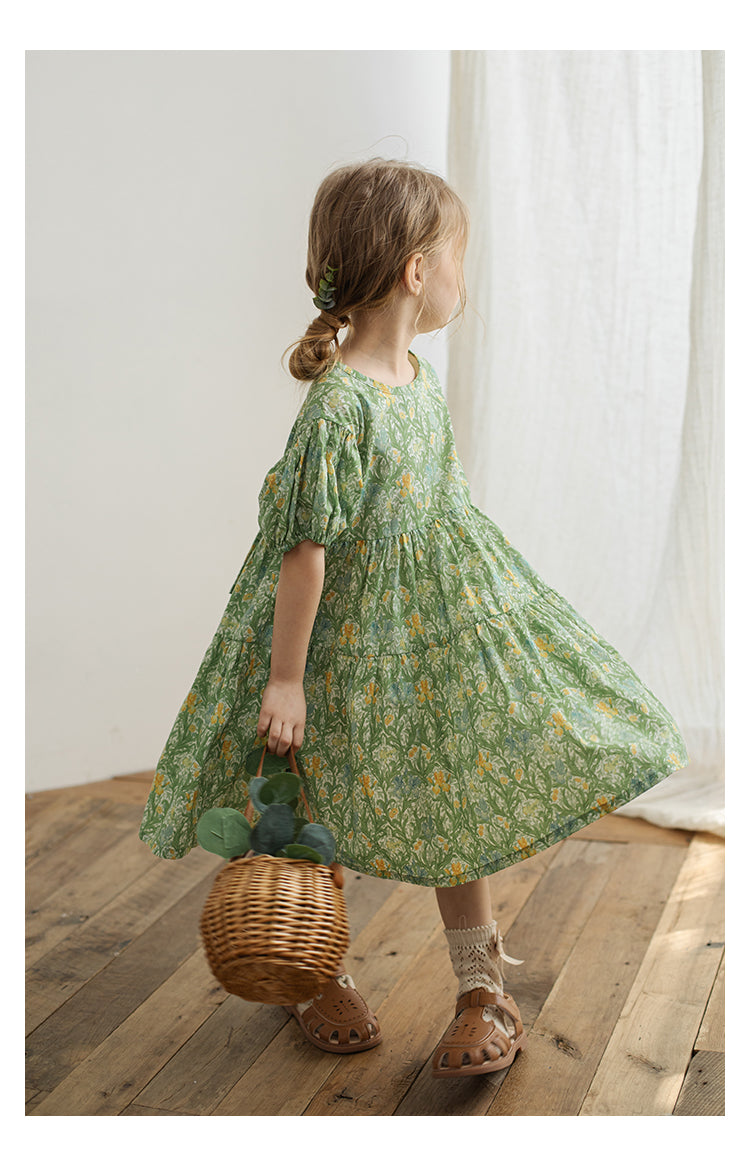 Detail of elasticated cuffs and gathered waist on girls summer dress