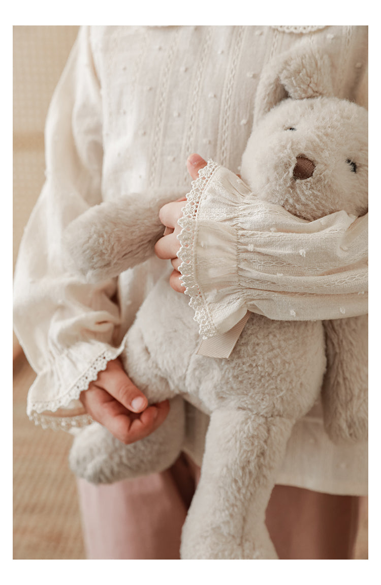 Close-up of lace-trimmed and elasticated cuffs on girls blouse