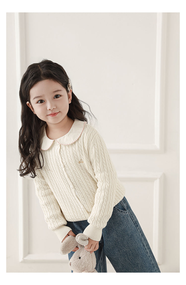 girl wearing Soft and warm cable knit cardigan styled with jeans