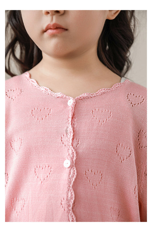 Close-up of heart knit pattern on girls lyocell cardigan, in light pink