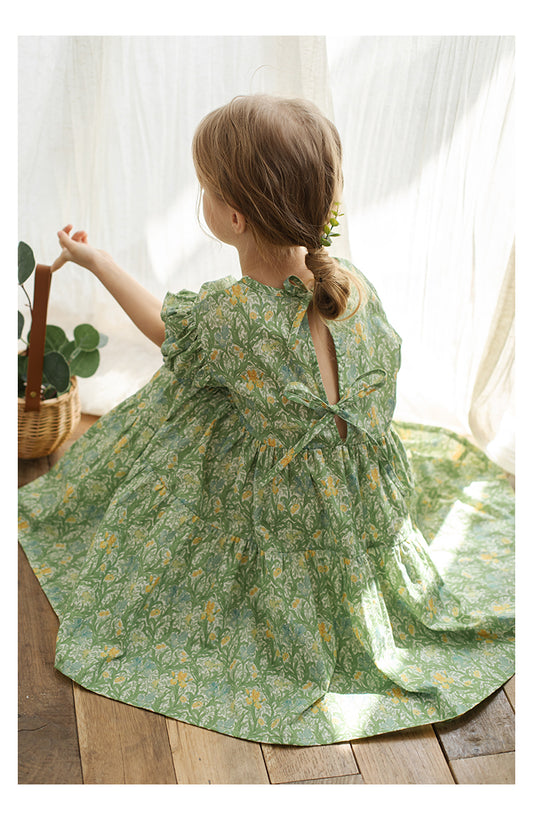 Back view of girls green floral summer dress with ribbons