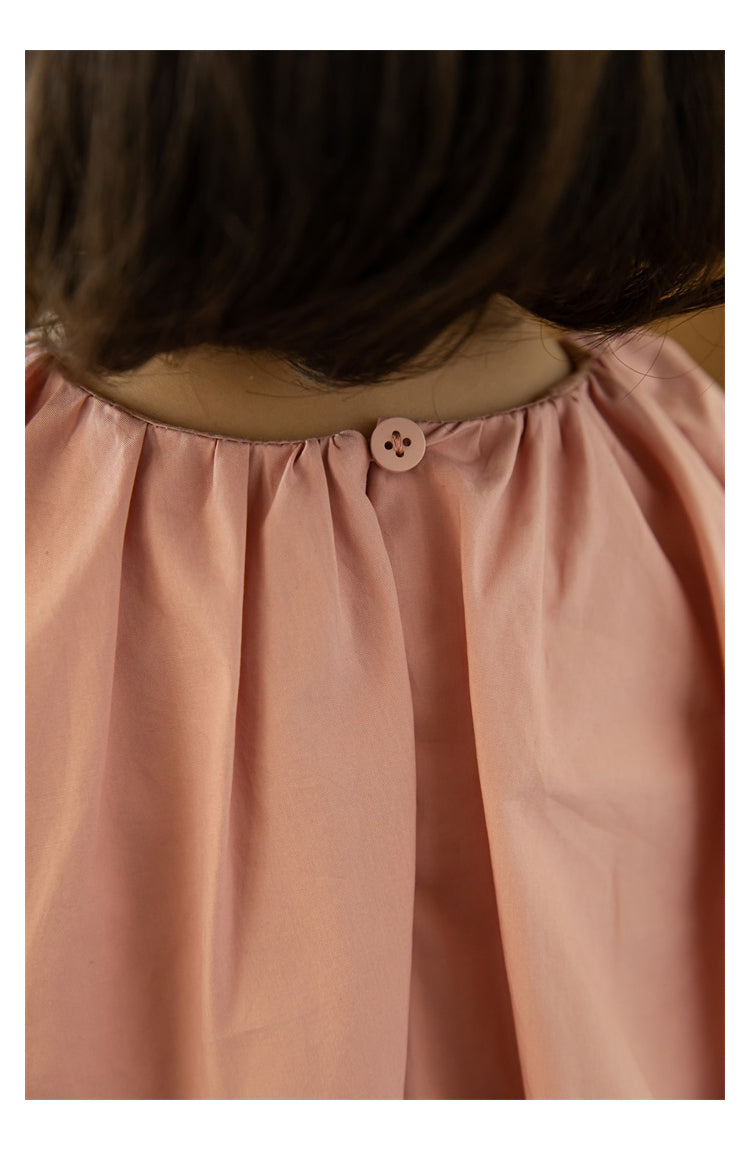 Back view showing single button closure on summer dress