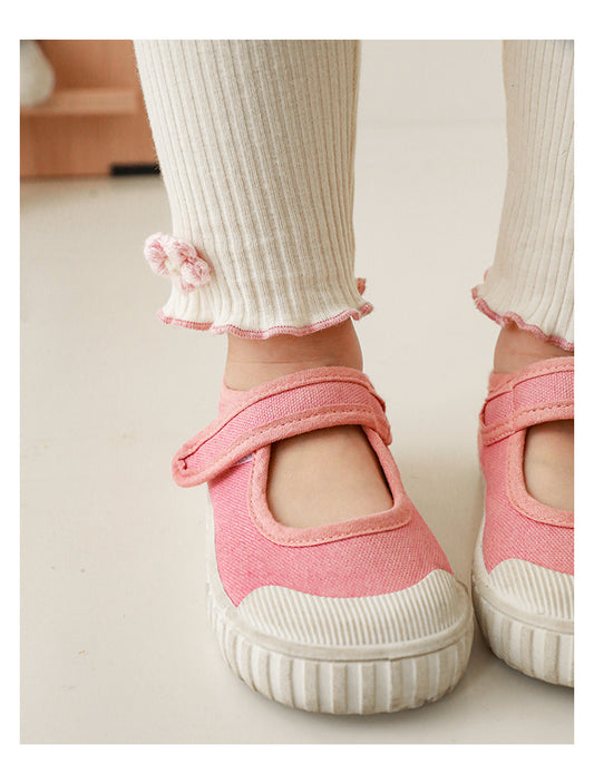 Close-up of floral crochet on ribbed girls leggings, in cream colour
