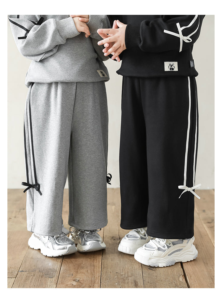 Ribbon-accented girls sweat set with adjustable cuffed ankles