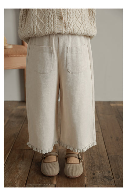 Soft breathable smart trousers for kids featuring ruffled lace trim - Ava & Bear London