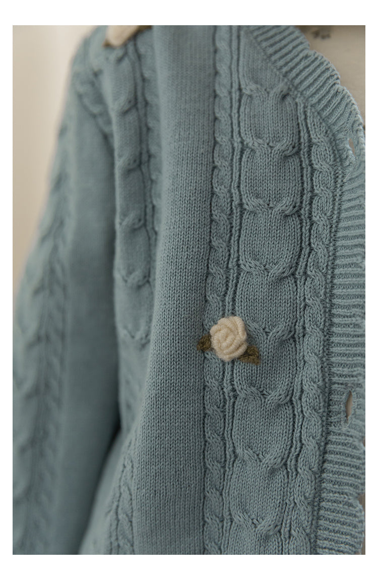 Soft blue cardigan for girls featuring cable knit and floral crochet detail