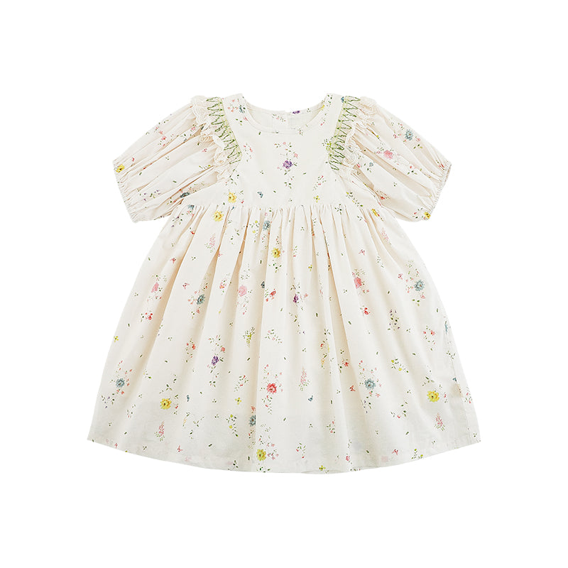 Girls' white floral dress with puffed sleeves, ruffle lace shoulders, cinched waist, and button back closure.