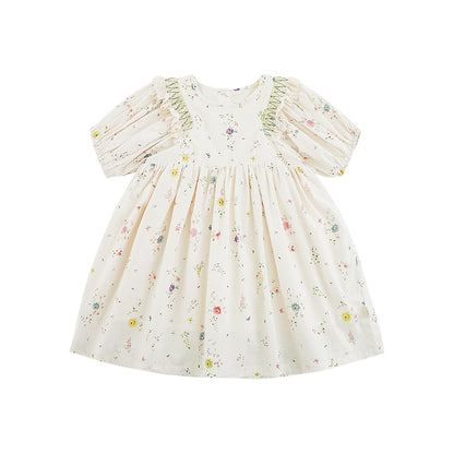 Girls' white floral dress with puffed sleeves, ruffle lace shoulders, cinched waist, and button back closure.