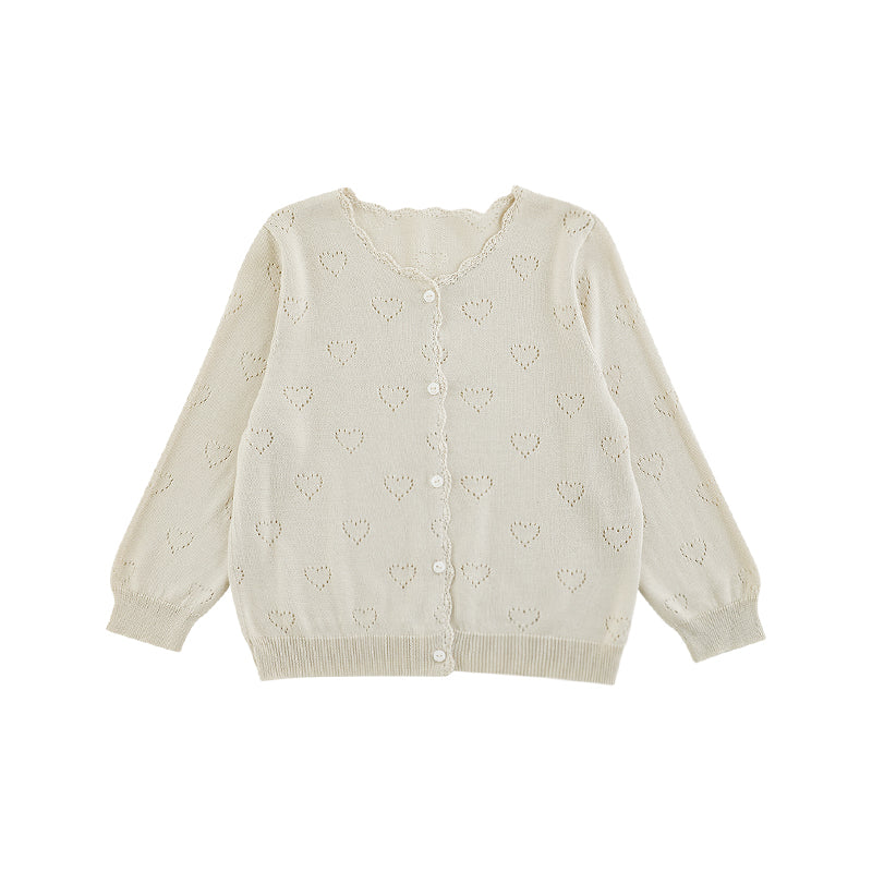 Close-up of heart knit pattern on girls lyocell cardigan in light beige