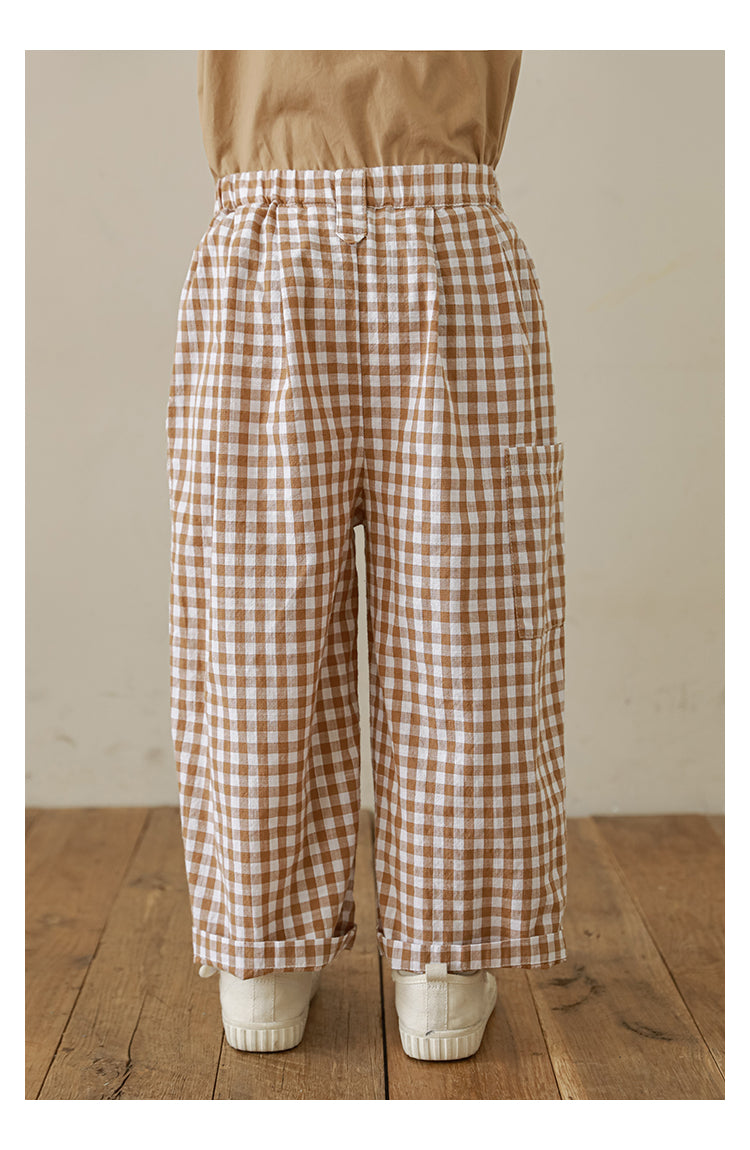 Back view of Stylish girls’ gingham trousers in soft cotton with pleat detailing