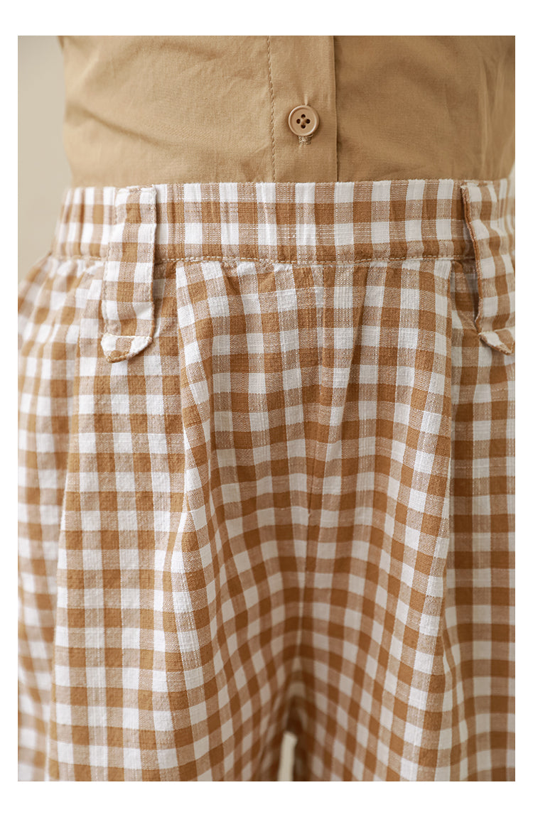 Close-up view of comfortable and elegant girls’ gingham trousers made from lightweight cotton