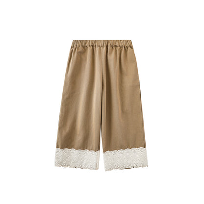 girls khaki cotton trousers with white lace trim on a white background