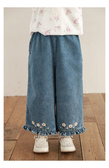 Flowy wide-leg girls jeans with playful ruffles
