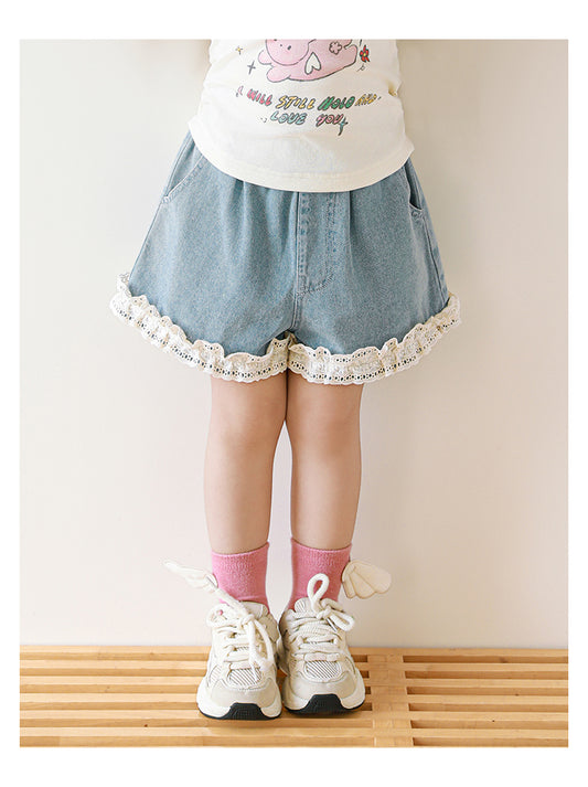 Girls blue denim shorts with lace detail on hem